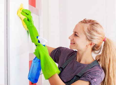 Carpet cleaning technician with safety equipment in a Hounslow property