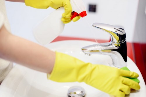 Deep cleaning kitchen and bathroom areas in a rental property